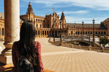 Woman tourist back in Square of Spain in Seville, Andalusia