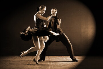 Fototapeta na wymiar Dancers in ballroom isolated on black background