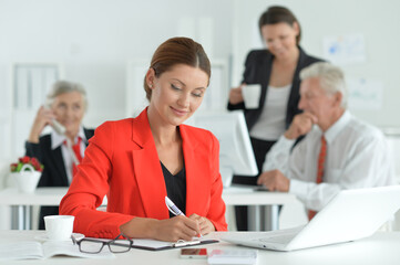 group of successful business people  working   in modern office