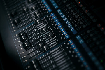 audio sound mixer controller at studio in dark background