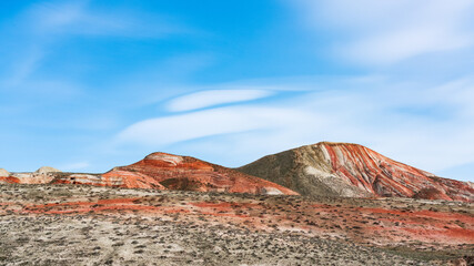 Beautiful striped landscape of red mountains