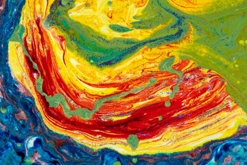 Multicolored marble acrylic background. A smudged spot of various paints covered with sequins....