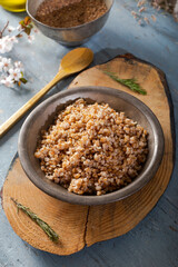 Einkorn, Triticum Monococcum, Siyez wheat bulgur.Bulgur pilaf made with siyez bulgur in plate on wooden background.