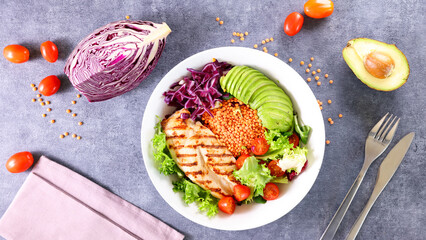 grilled chicken and vegetable salad in bowl