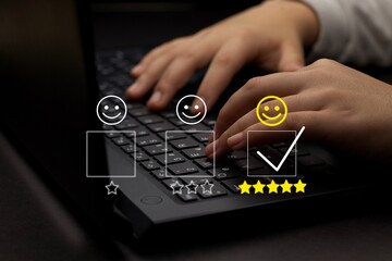 Customer service and Satisfaction concept ,Business people are touching the virtual screen on the happy Smiley face icon to give satisfaction in service. rating very