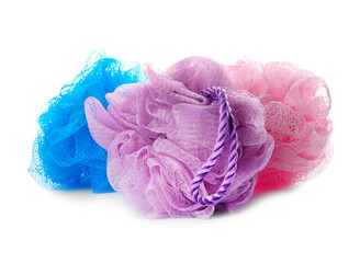 Set with new shower puffs on white background
