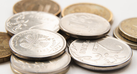 metal, round gray and gold coins in close-up. russian ruble