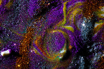 Multi-colored dark background sprinkled with purple and gold sparkles with streaks and waves....