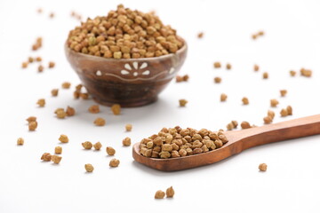 Dried chickpeas in bowl isolated on white background.