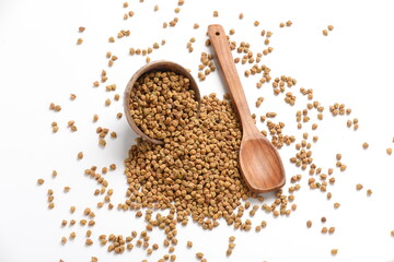 Dried chickpeas in bowl isolated on white background.