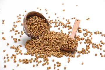 Dried chickpeas in bowl isolated on white background.