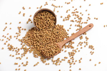 Dried chickpeas in bowl isolated on white background.