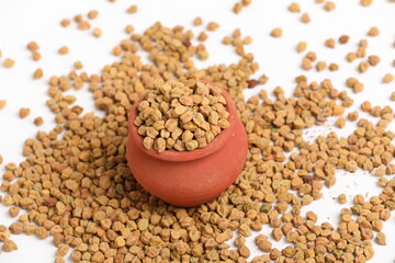 Dried chickpeas in bowl isolated on white background.