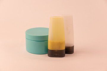 shampoo, hair conditioner and scrub on a white background