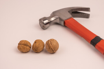 open a walnut with a hammer