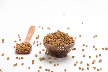 Dried chickpeas in bowl isolated on white background.