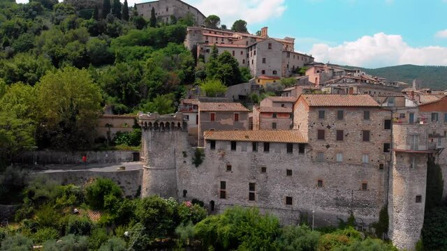 Aerial view of Narni (Terni, Umbria, Italy), medieval city with a rich history. Houses made of stone on top of the mountain. Incredible views. Summer day. Europe travel and vacation concept