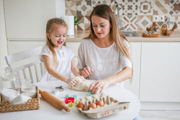 family, food and people concept - happy mother and daughter having breakfast at home