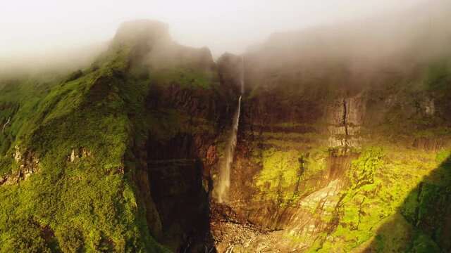 Poco Ribeira do Ferreiro, Alagoinha, Flores Island, Portugal. A magnificent, intact, natural beauty on a foggy day. Aerial view of clear-water creeks cascading onto rocks. High quality 4k footage