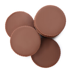 Delicious peanut butter cups on white background, top view