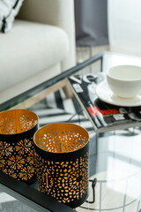 candlesticks on a glass table