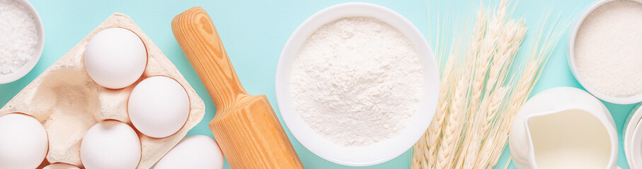 Ingredients for baking on light blue background.
