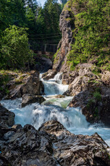 Wild Varinka river with rocks around and stones on Vratna dolina valley in Mala Fatra mountains in Slovakia