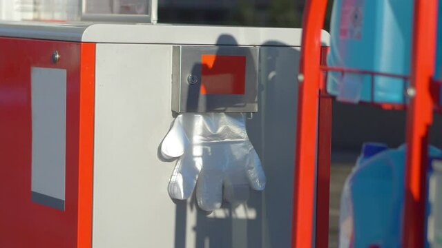 Plastic gloves at the gas station in 4K slow motion 60fps 