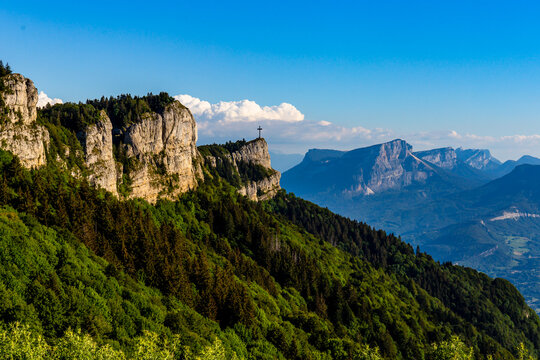 Summer beautiful mountain view. France, croix du Novolet. A big cross on top of the mountain.