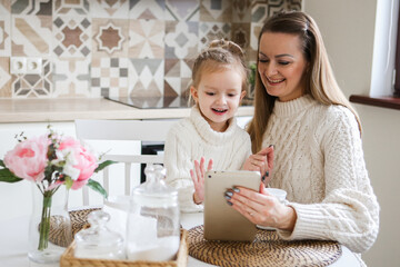 Woman in light clothes have fun with cute baby girl. Mother, little child daughter. isolated on...