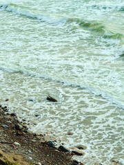 Small waves crashing on the beach