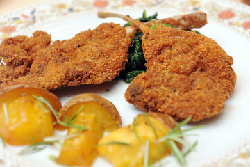 Abbacchio fritto or fried lamb is a typical dish of the Lazio region and of the Easter holidays served whit potatoes