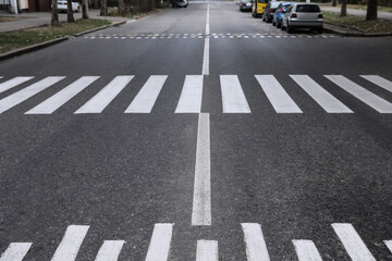 White pedestrian crossing on modern city street