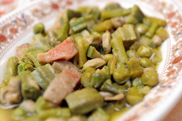 Vignarola is a typical dish of the Lazio region and typical food from Rome area based on Roman artichokes, peas, broad beans, asparagus and other fresh spring vegetables