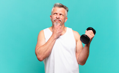 senior athlete man thinking, feeling doubtful and confused, with different options, wondering which...
