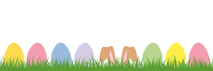 hare ears in the meadow between colorful Easter eggs
