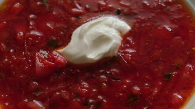 Poltava borsch with sour cream, close-up