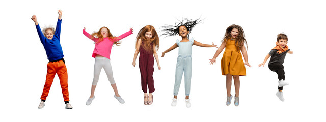 Little and happy kids gesturing isolated on white studio background. Human emotions, facial...