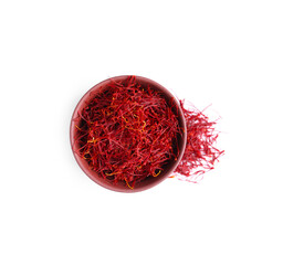 Naklejka premium Dried saffron and bowl on white background, top view