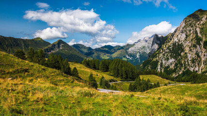 Fototapeta na wymiar Alpine huts, meadows, lakes and woods of the Friulian mountains