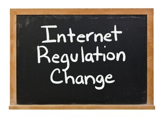 Obraz premium Internet Regulation Change written in white chalk on a black chalkboard isolated on white