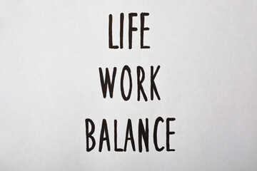 Life, Work, Balance written on white background, top view