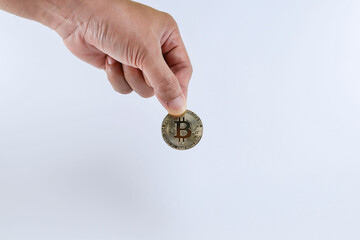 Cropped hand holding bitcoin isolated on white background