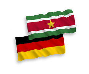 Flags of Republic of Suriname and Germany on a white background