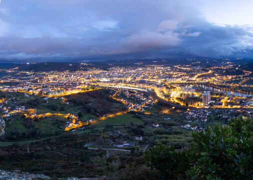 Ourense town lights up at sunset. Ourense is the capital of Galicia, Autonomous community in the Northwest of Spain. 