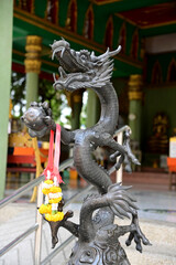 Black dragon statue Located in front of a Thai temple in Bangkok, Thailand.