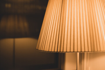 floor lamp with warm light and reflection in the window