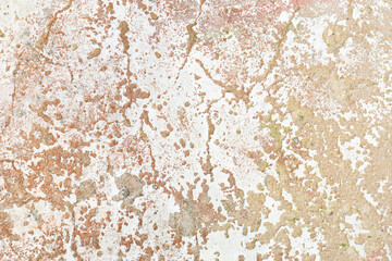 old and cracked cement wall, with light shades of worn and deteriorated paint due to the passage of time