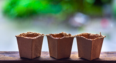 Fibre pot isolated on blurred background.