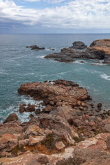 Fototapeta na wymiar Picturesque view of red rocks and Mediterranean sea from the cape Cabo de Palos, Murcia, Spain